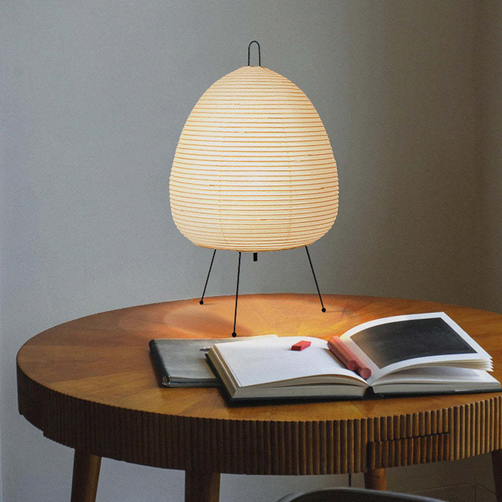 Renée floor lamp on a round table with book