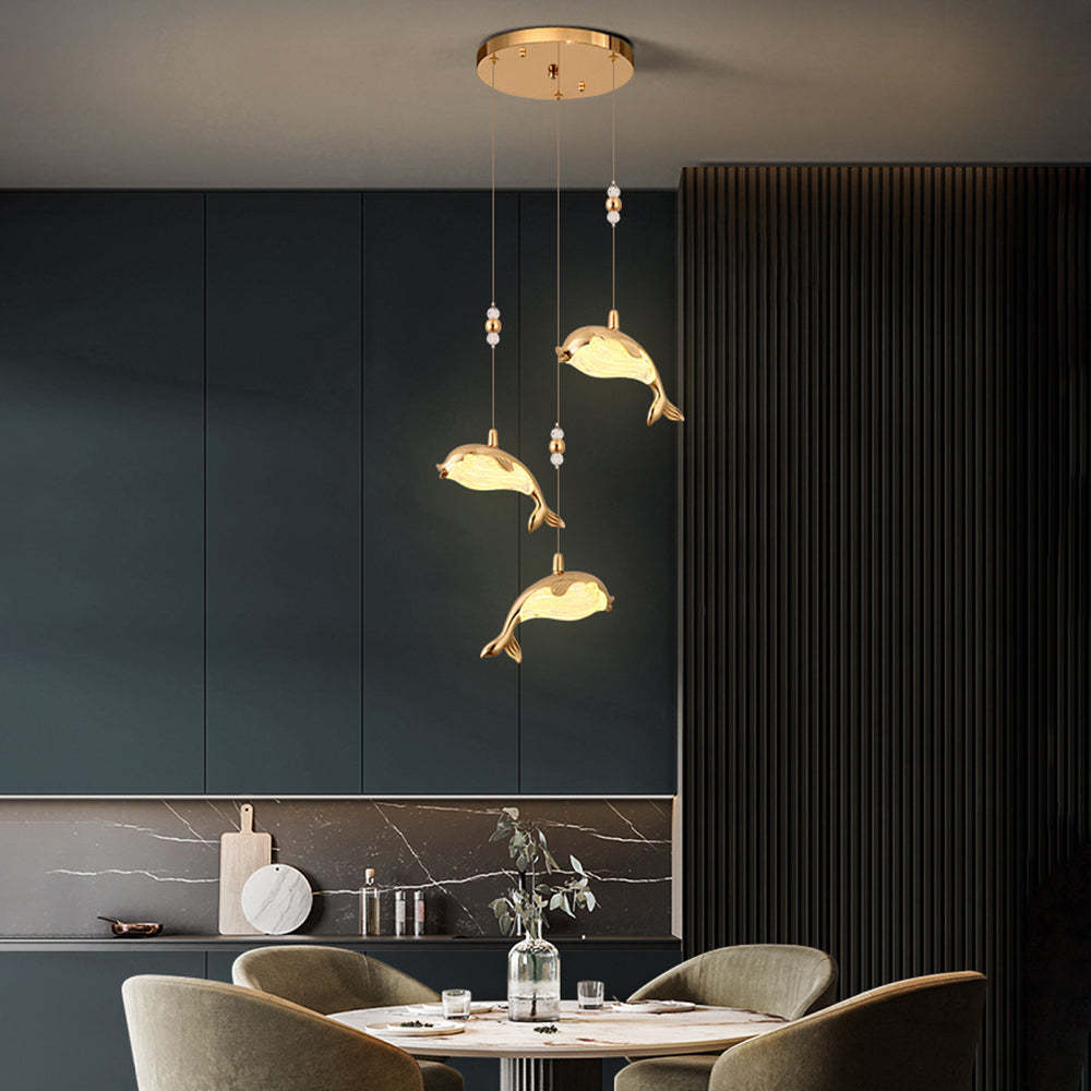 Golden Dolphin Pendant Light in a Dining Room
