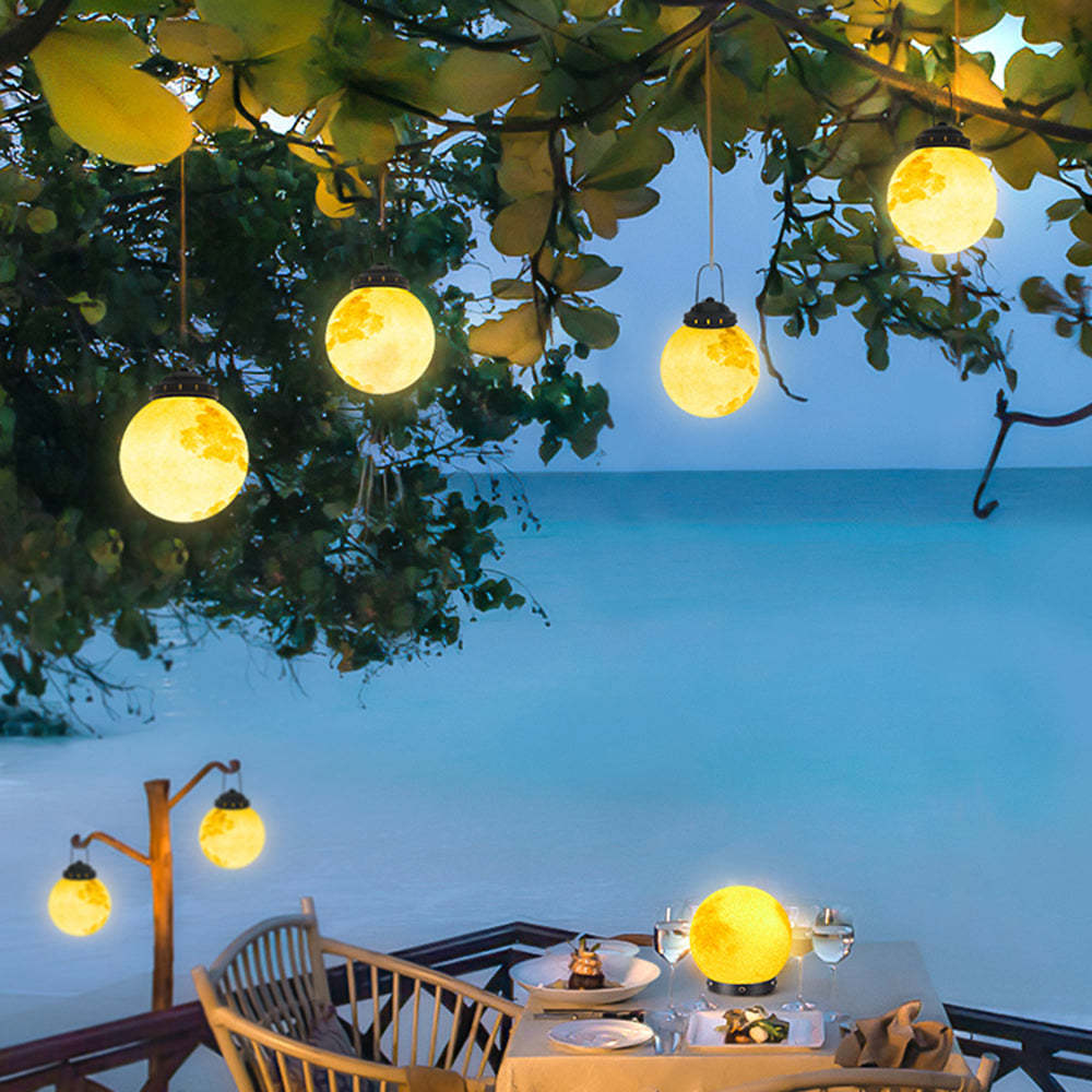 Elif Moon Outdoor Light on beachside table