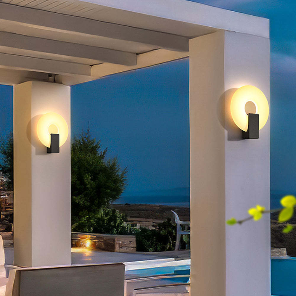 Outdoor wall lamp illuminates garden at night