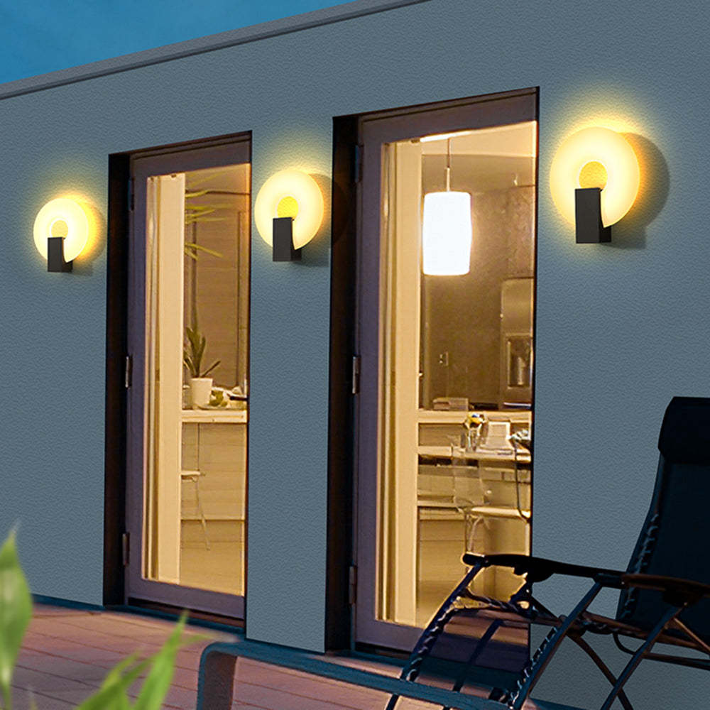 Isaac outdoor wall lamp illuminating exterior at night