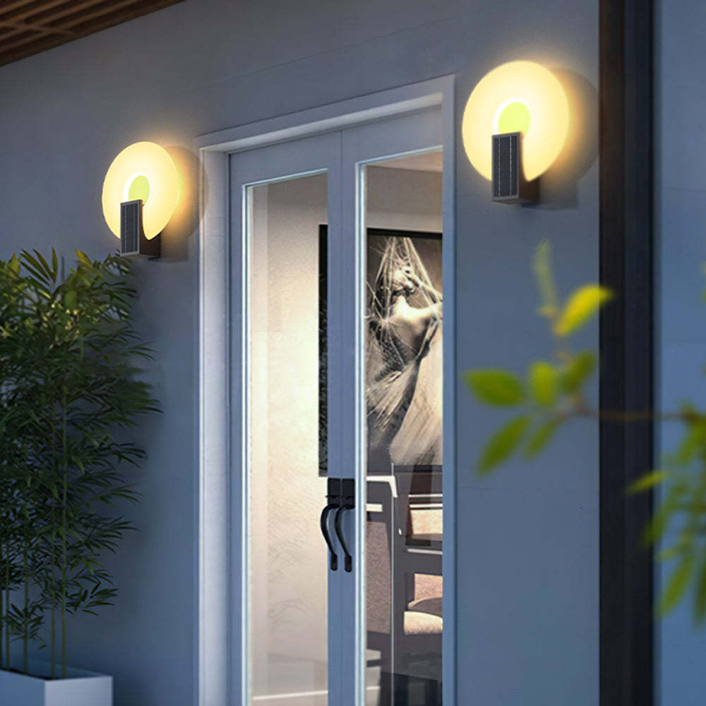 Isaac Solar Outdoor Wall Lamp illuminating exterior at night