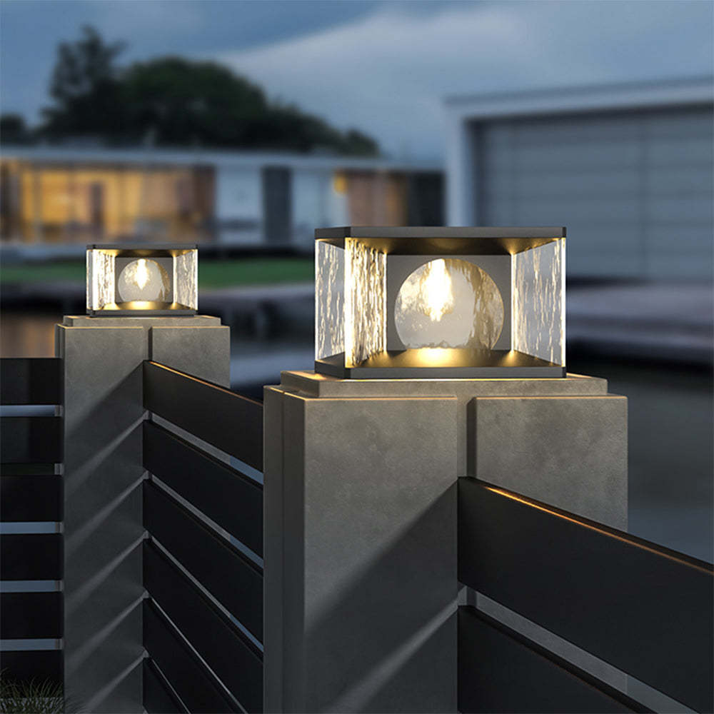 Riley Modern Outdoor Pillar Light on fence at dusk