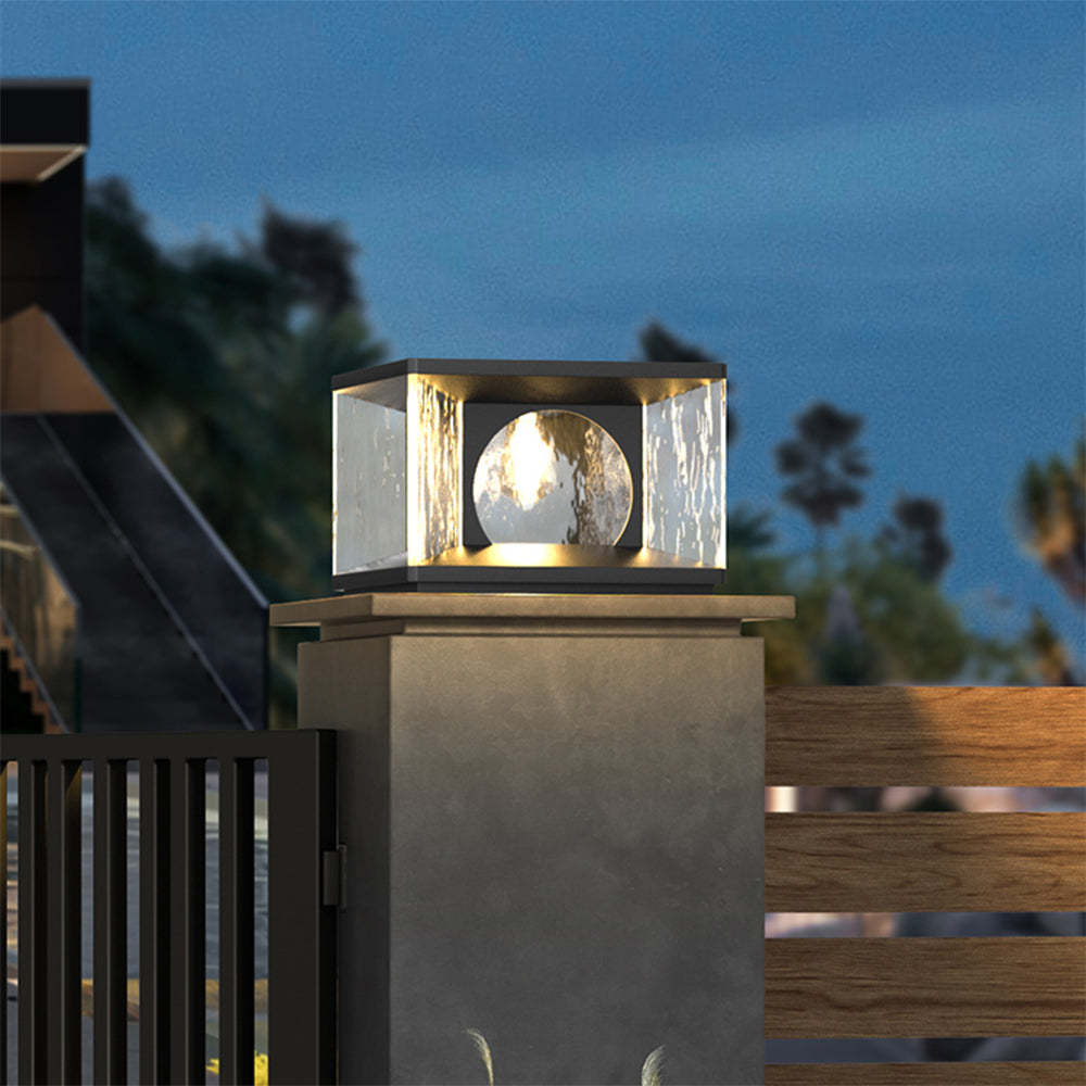 Riley Modern Outdoor Pillar Light illuminating garden