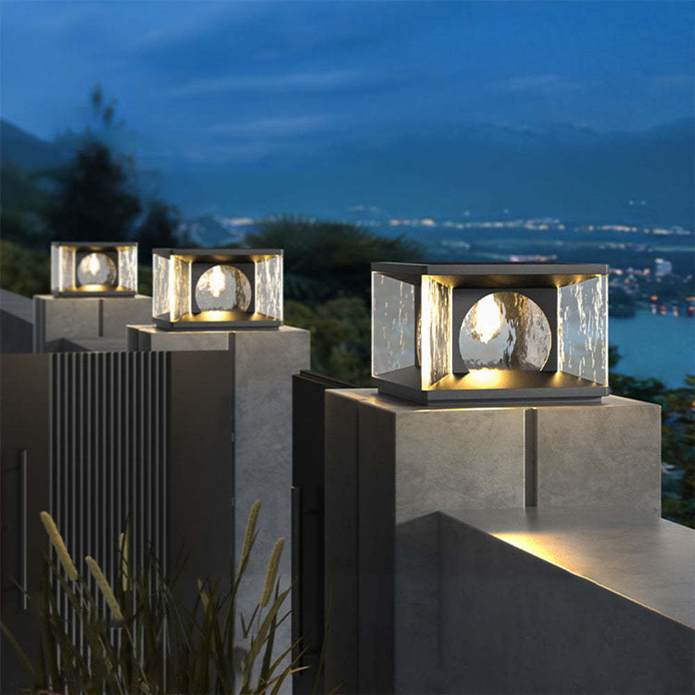Riley Modern Outdoor Pillar Lights on Concrete at Dusk