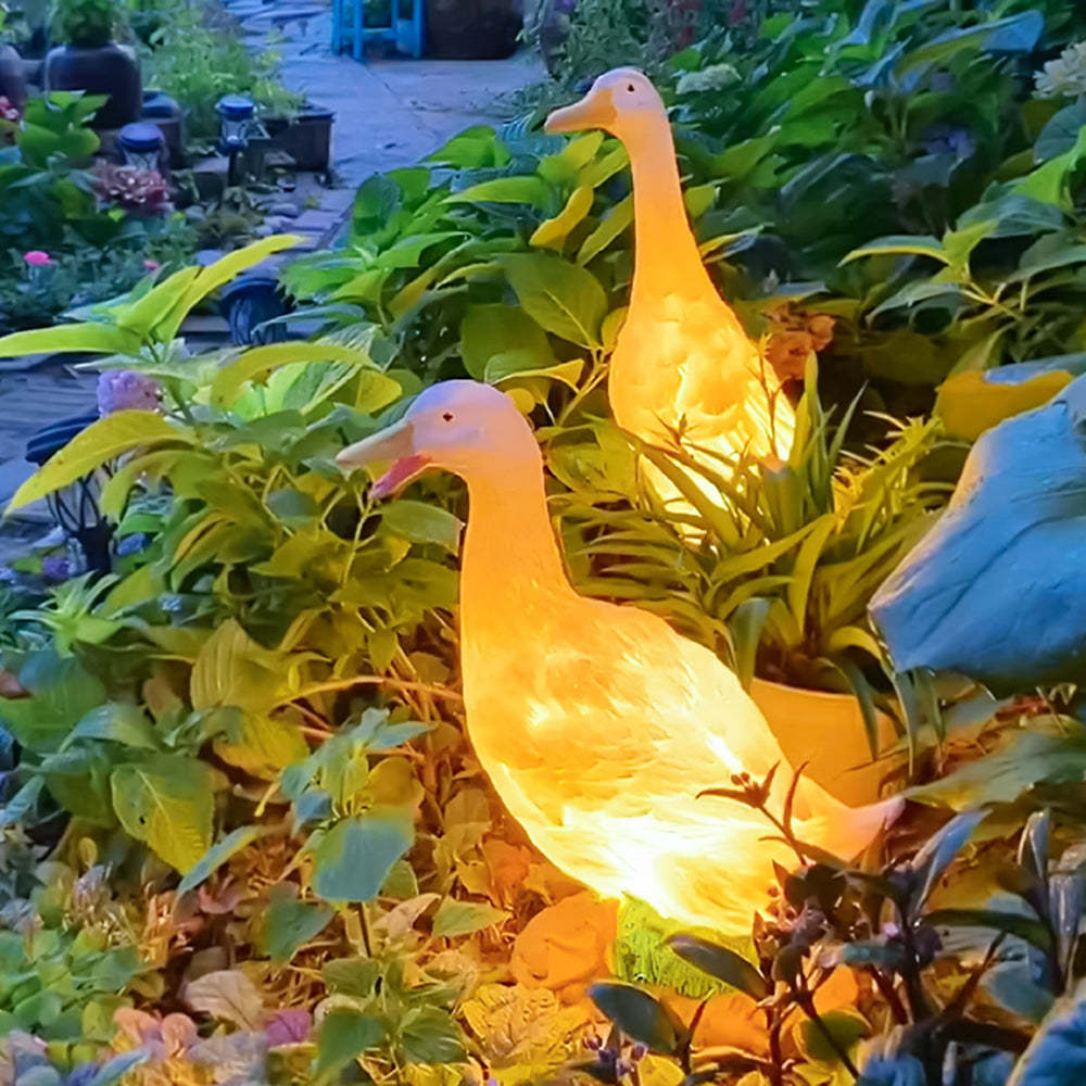 Lit Goose Garden Lights in Lush Greenery