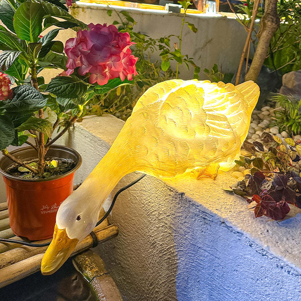 Glowing Minori Goose Garden Light in Garden Setting