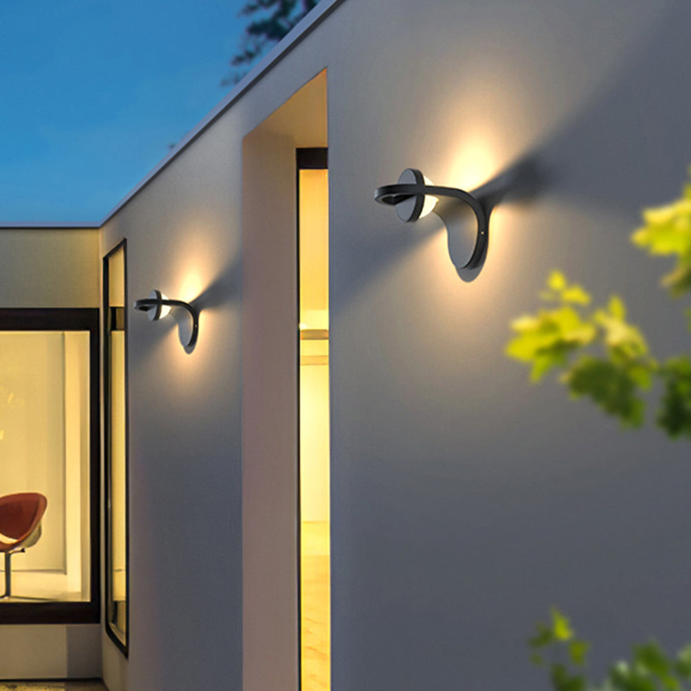 Orr modern solar wall lamp on exterior wall, Las Sola lighting Orr Modern Arc Metal Acrylic Solar Waterproof Adjustable Outdoor Wall Lamp