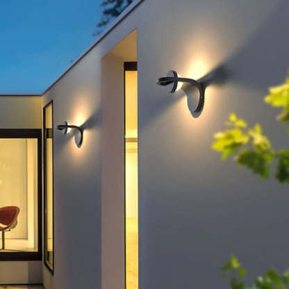Orr modern solar wall lamp on exterior wall, Las Sola lighting Orr Modern Arc Metal Acrylic Solar Waterproof Adjustable Outdoor Wall Lamp