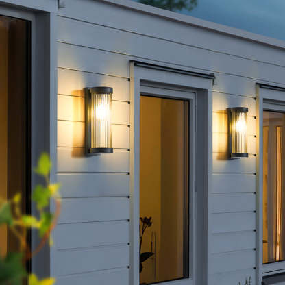 Orr outdoor wall lamp illuminating a white exterior wall
