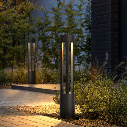 Pena Modern Path Light illuminating a garden at night