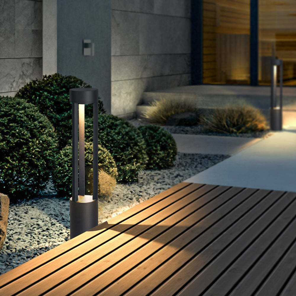 Outdoor path light illuminating a modern garden