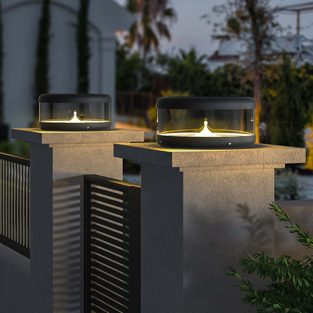 Riley Outdoor Pillar Lights illuminating a garden