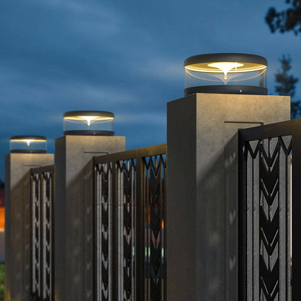 Riley outdoor pillar lights illuminating fence at night