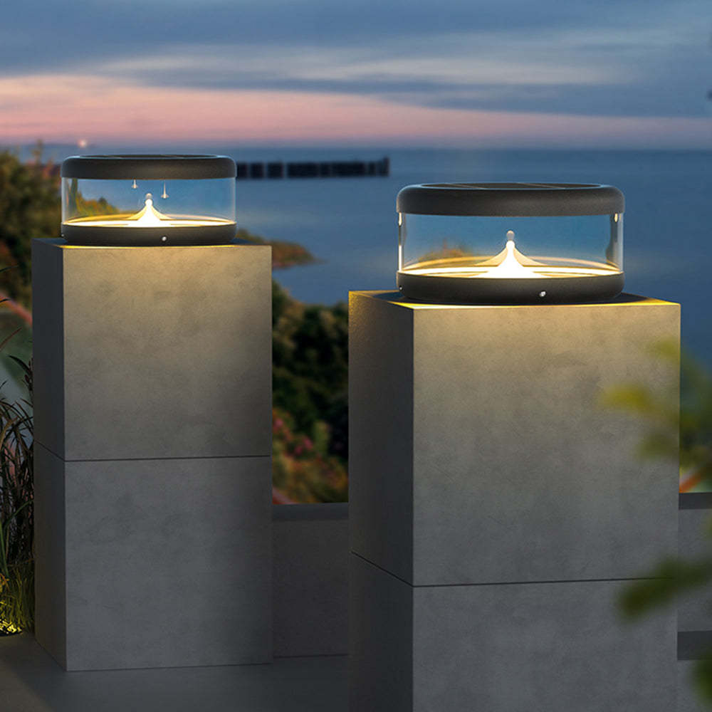 Riley Quicksand Solar Pillar Lights illuminating a garden