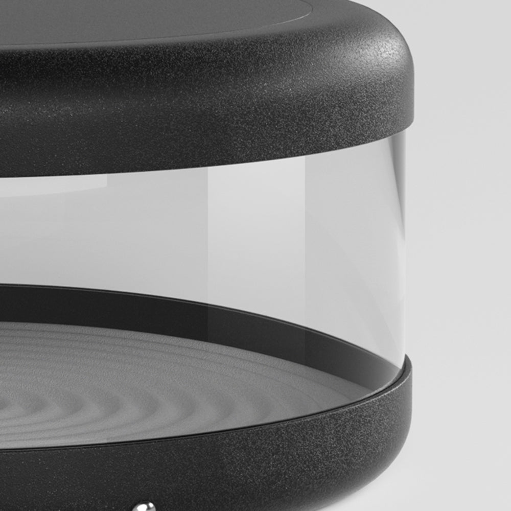 Riley Modern Cylinder Lamp close-up, warm light, black metal detail