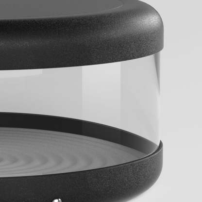 Riley Modern Cylinder Lamp close-up, warm light, black metal detail