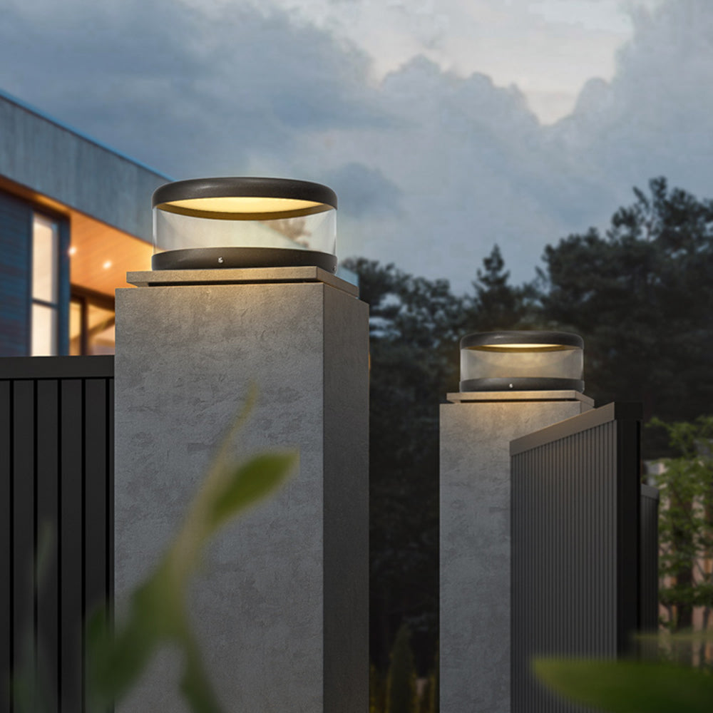 Riley modern outdoor pillar lights illuminating fence