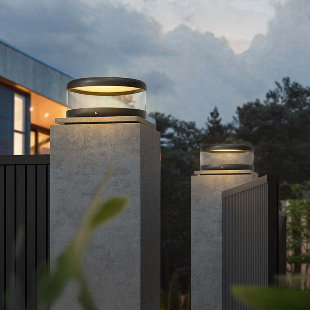 Riley modern outdoor pillar lights illuminating fence