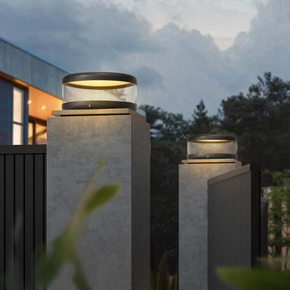Riley modern outdoor pillar lights illuminating fence