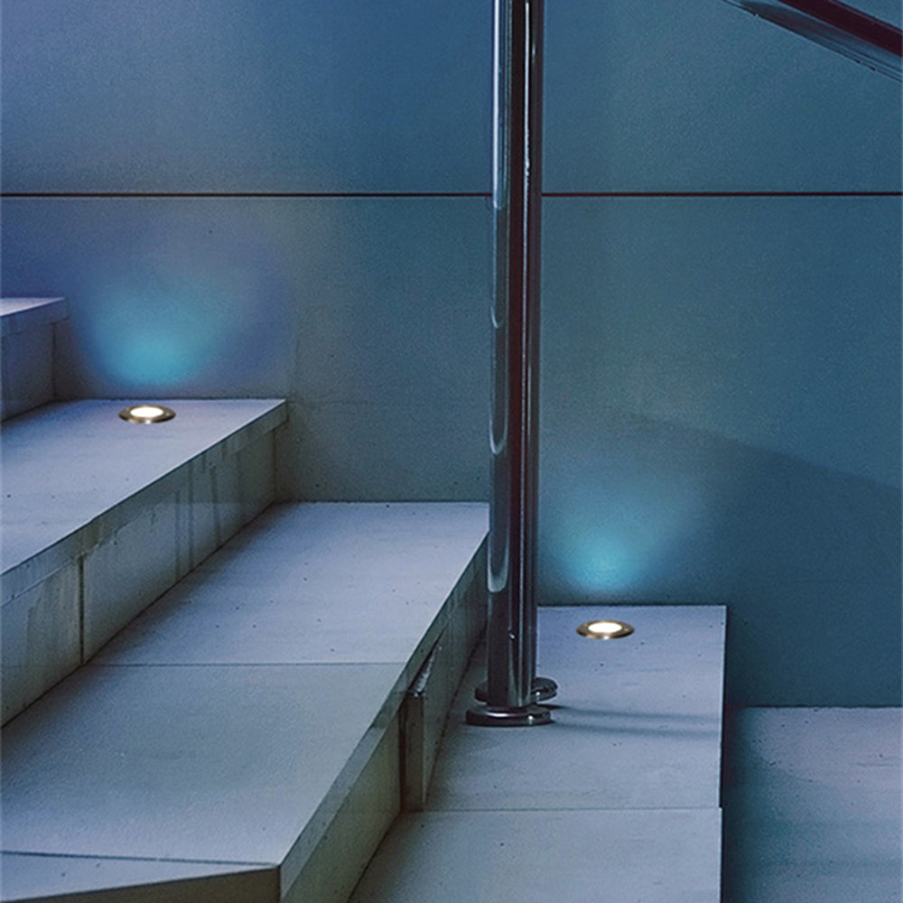 Pena metal recessed step lights illuminate stairs.