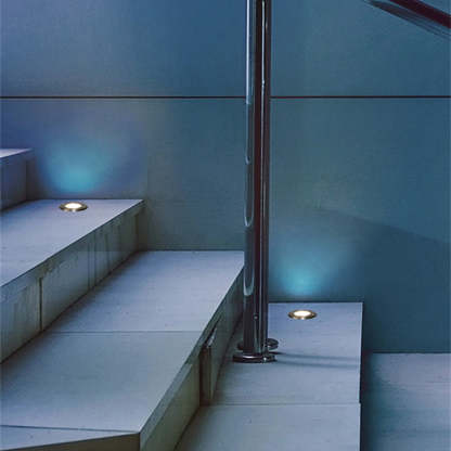Pena metal recessed step lights illuminate stairs.