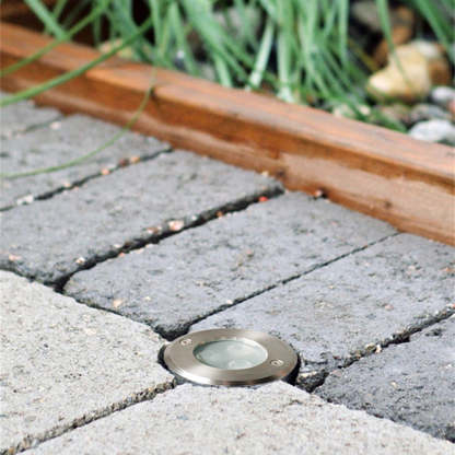Pena recessed step light on stone patio by Las Sola