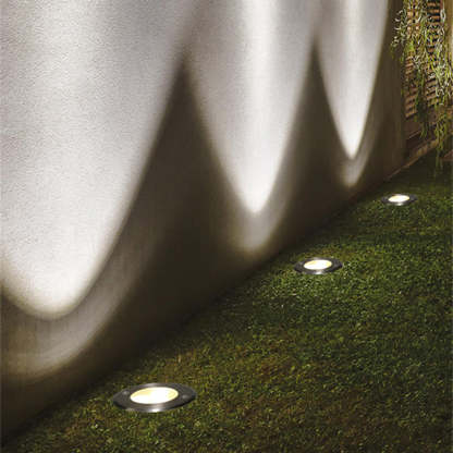Las Sola Pena recessed deck lights illuminate garden path.