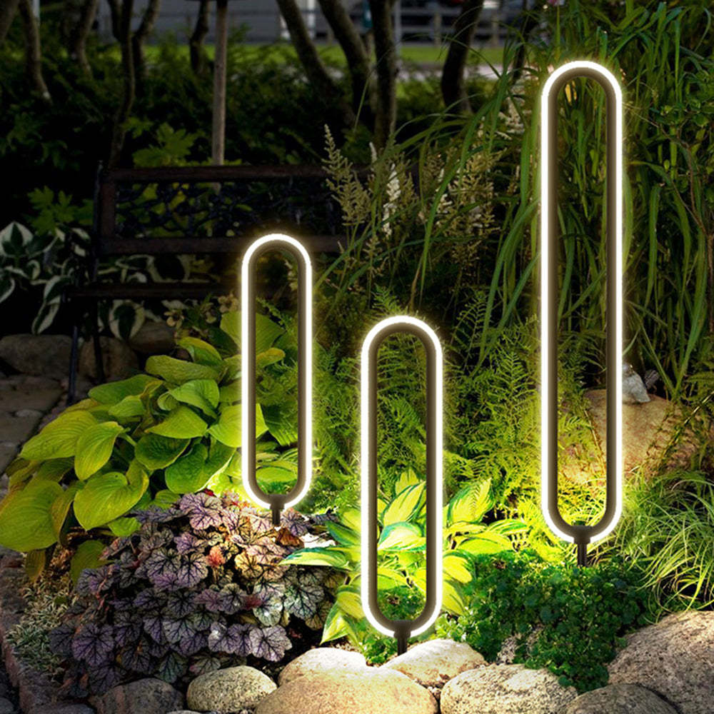 Modernist garden lit by Pena elliptical path lights