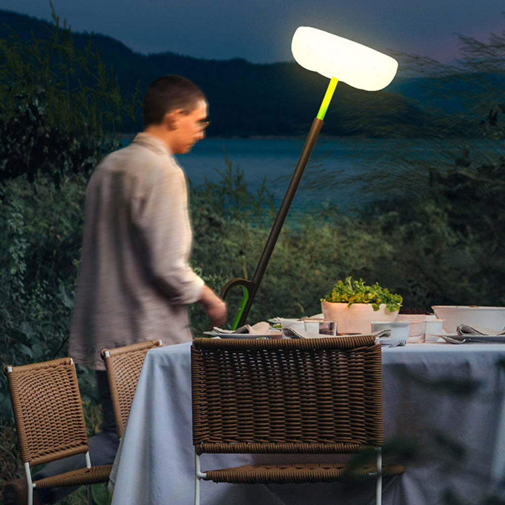 Orr solar floor lamp illuminates outdoor dinner table