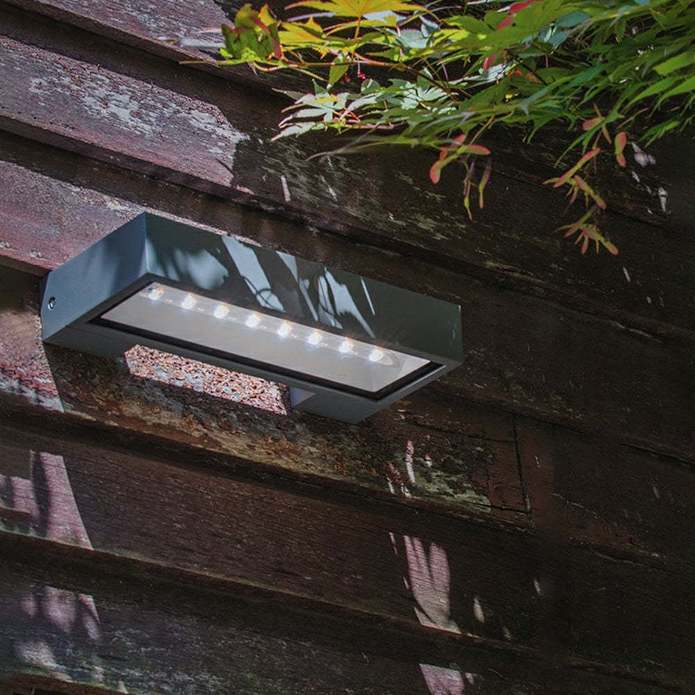 Orr Solar Wall Lamp on weathered wood. Modern outdoor lighting. Orr Modern Metal Acrylic Solar Waterproof Outdoor Wall Lamp