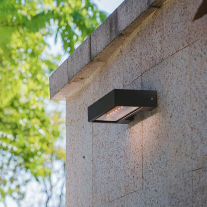 Orr modern solar wall lamp on stone wall. Outdoor lighting. Orr Modern Metal Acrylic Solar Waterproof Outdoor Wall Lamp