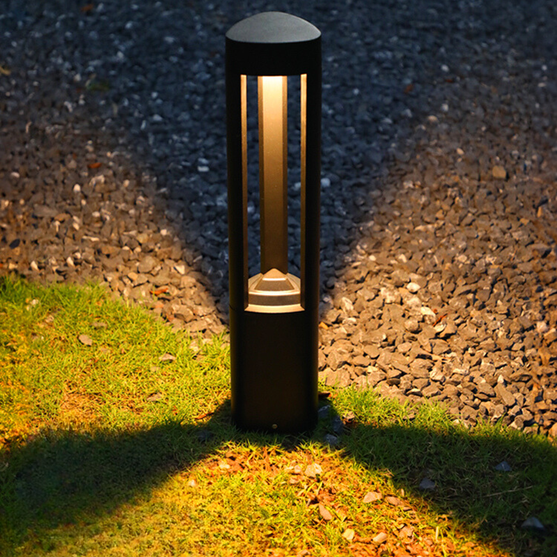 Pena Outdoor Path Light in a garden, illuminating warm light
