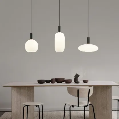 Minimalist pendant lights over dining table