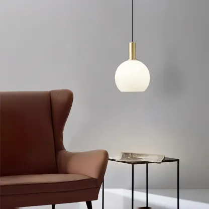 Modern bedroom lighting with brass and glass pendant