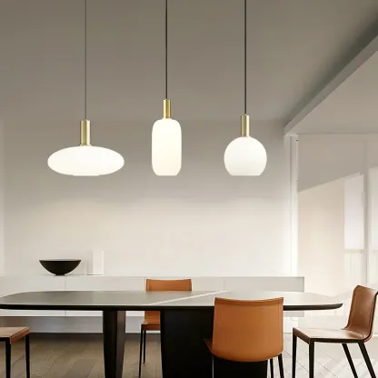 Modern dining room with brass and glass pendant lights