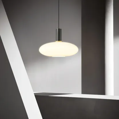 Minimalist Hailie pendant light with glass shade, brass accents