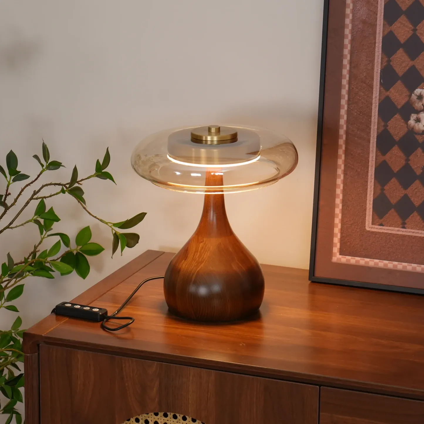 Ozawa Table Lamp on wooden cabinet with art