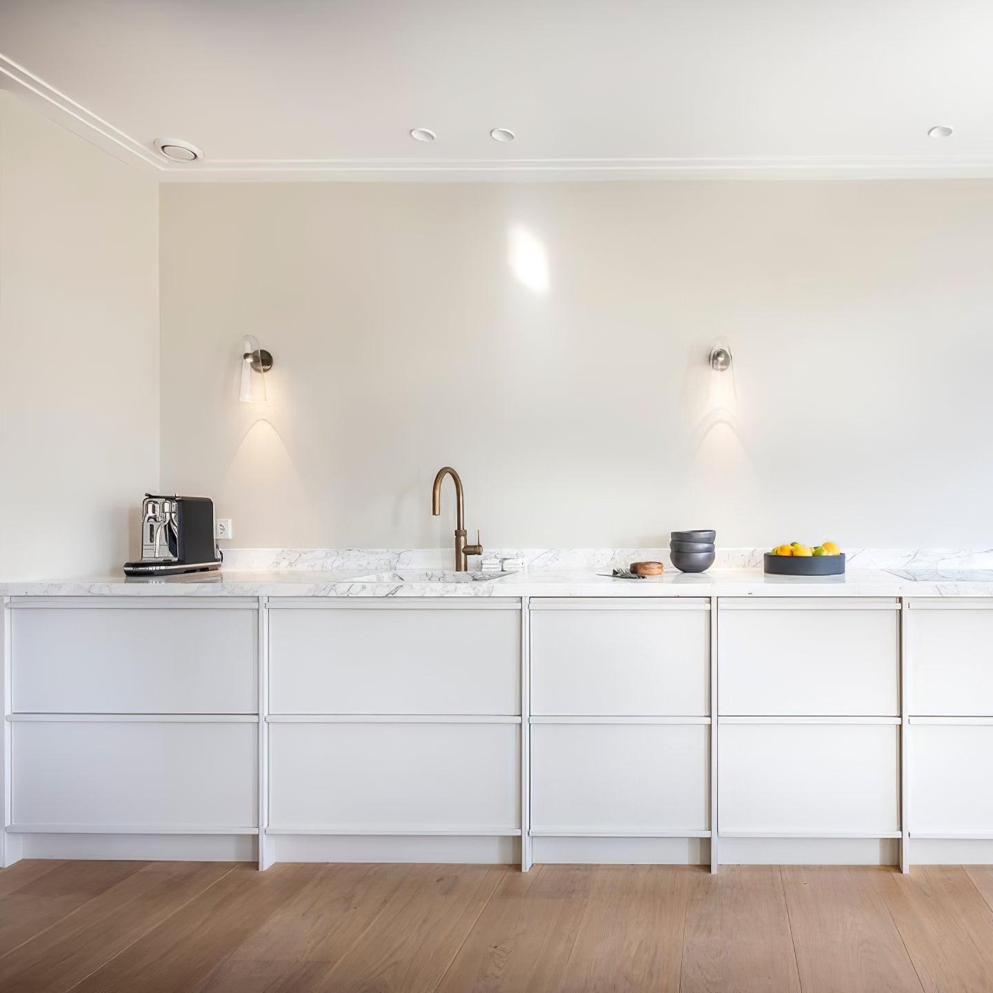 Blair Nordic wall lamp in modern kitchen. Glass and metal lighting.