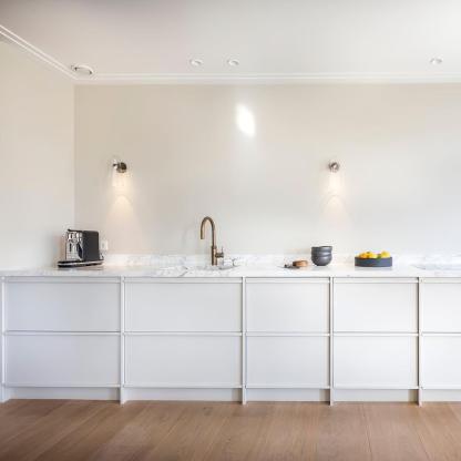 Blair Nordic wall lamp in modern kitchen. Glass and metal lighting.