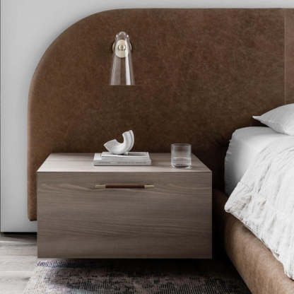 Nordic wall lamp in bedroom. Modern glass and metal lighting fixture.