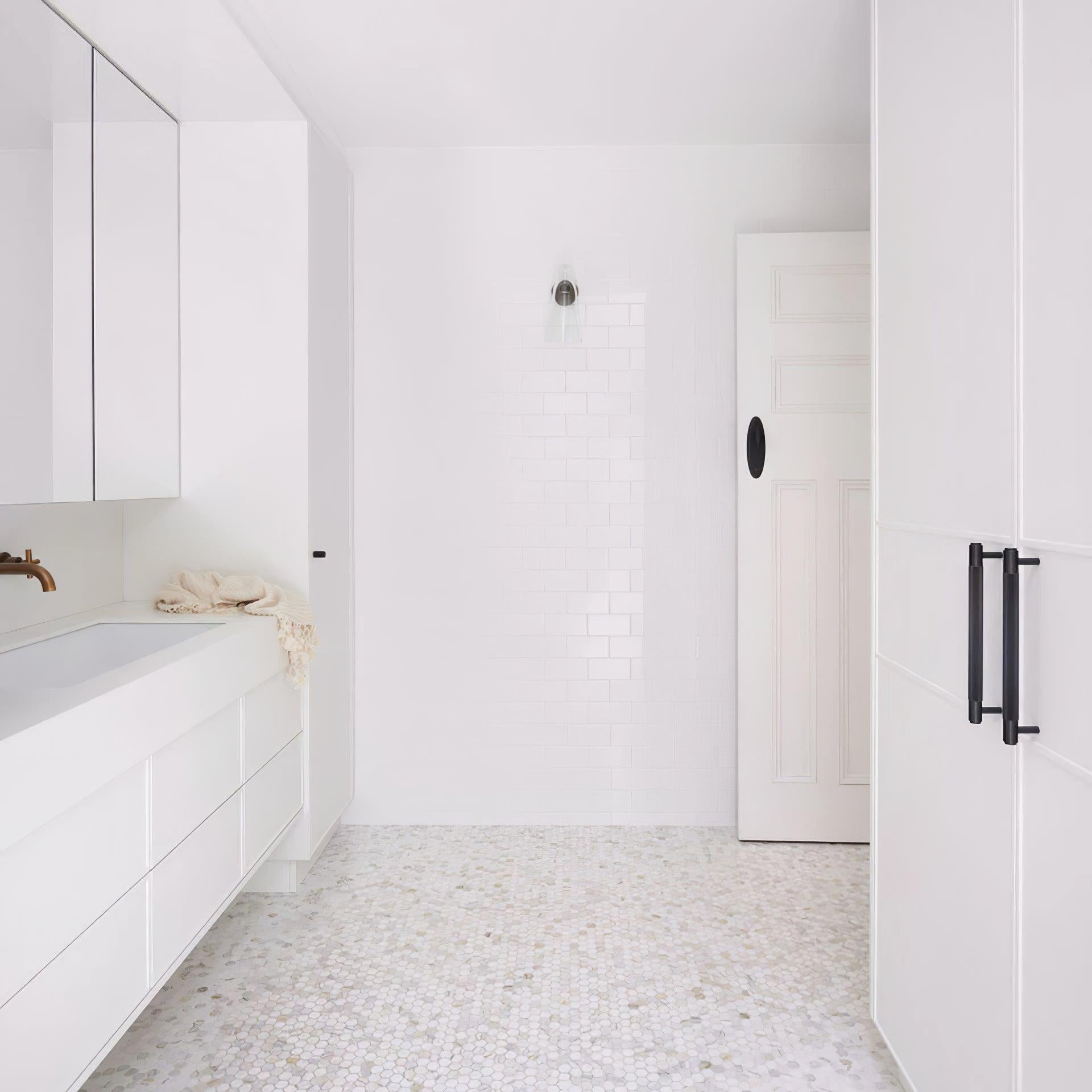 Blair Nordic wall lamp in all-white modern bathroom