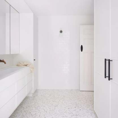 Blair Nordic wall lamp in all-white modern bathroom