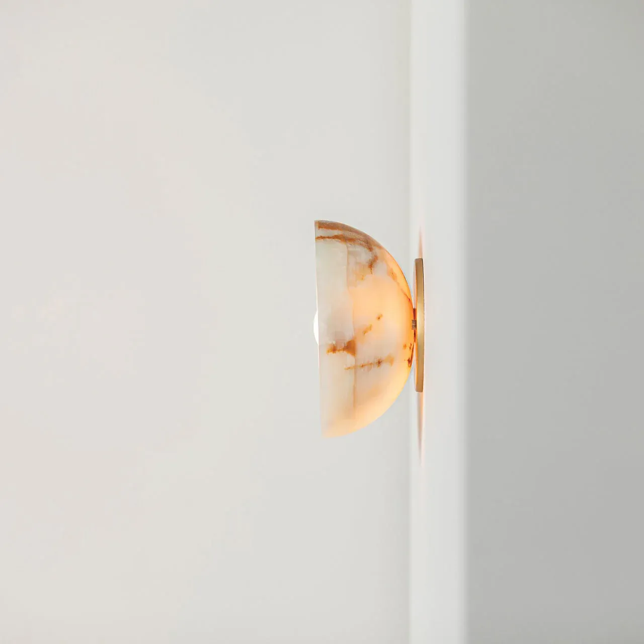 Elif Marble Wall Lamp, detail of the illuminated marble shade