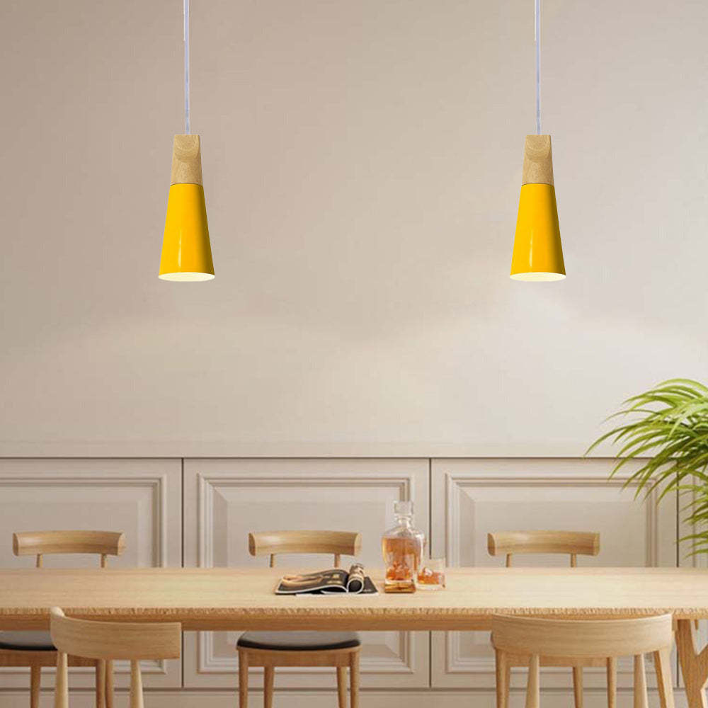 Yellow Morandi pendant lights above dining table