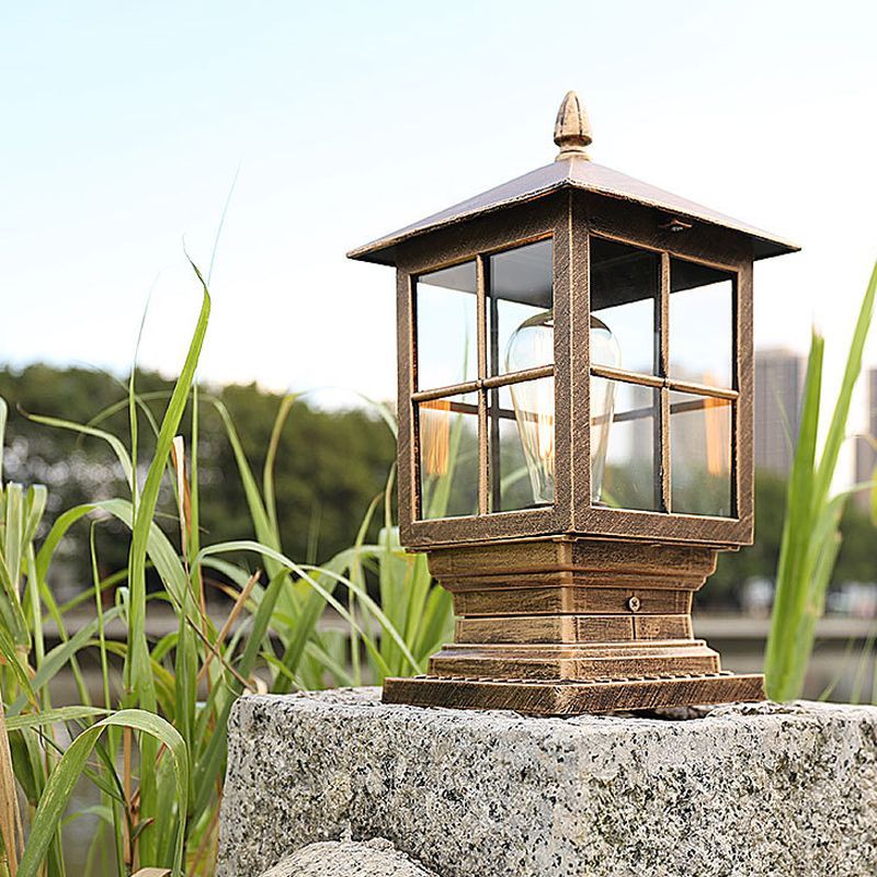 Alessio outdoor light post. Modern metal glass lantern on stone.
