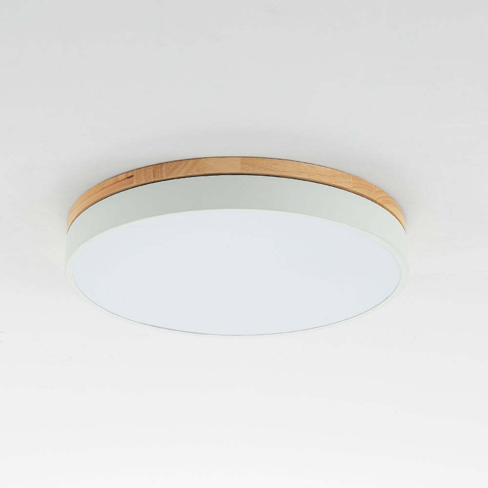 Round LED ceiling light with wood trim. Flush mount lighting.
