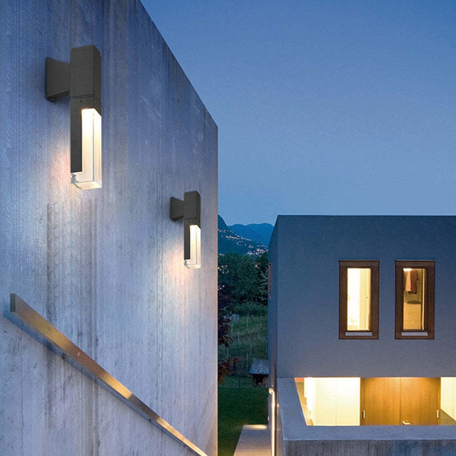Orr Outdoor Wall Lamp illuminating modern exterior at dusk