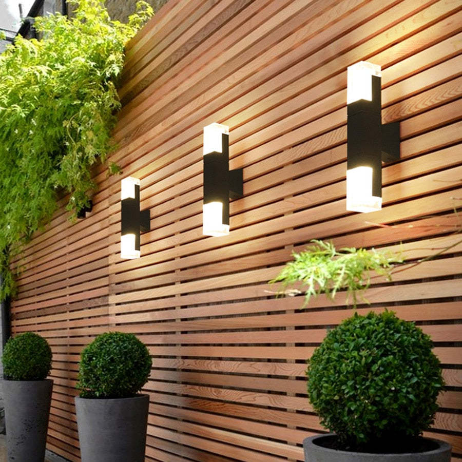 Modern outdoor wall lights on wooden fence, Lassola lighting solutions