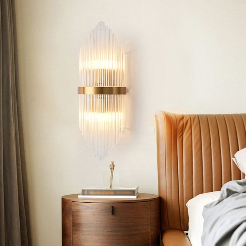 Luxury gold crystal wall lamp beside bed in bedroom